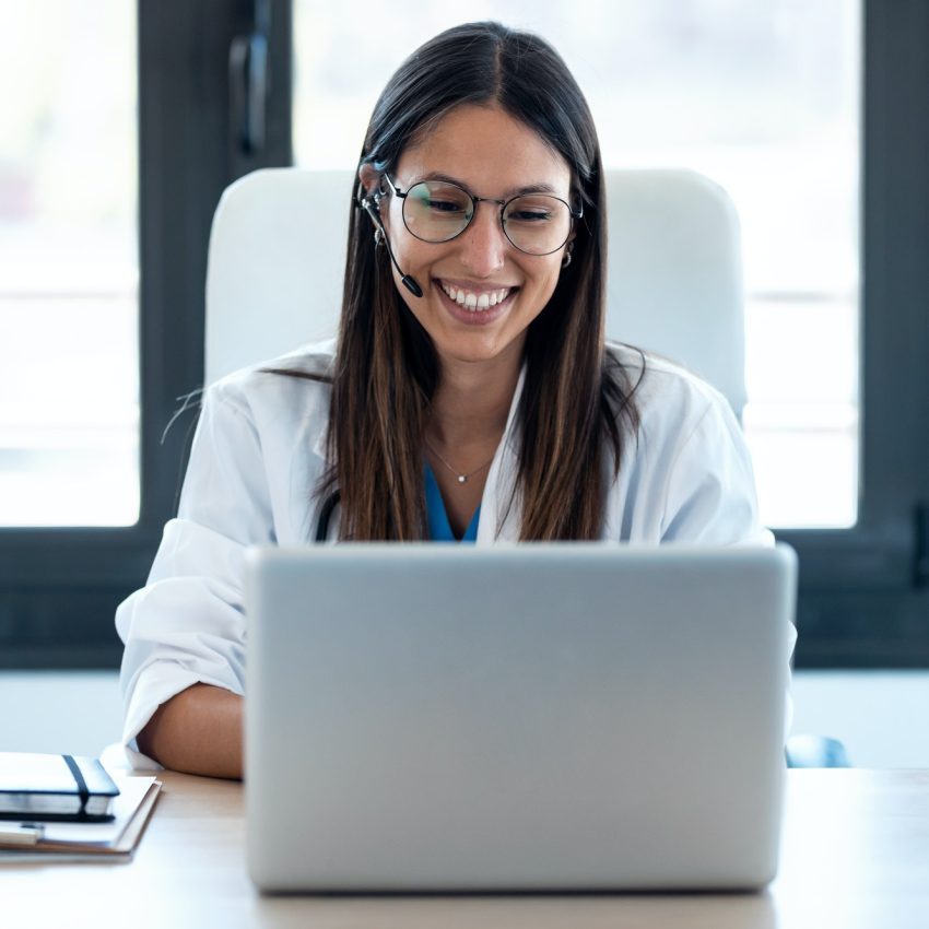 female-doctor-talking-with-colleagues-through-a-video-call-with-a-laptop-in-the-consultation-1-2.jpg female-doctor-talking-with-colleagues-through-a-video-call-with-a-laptop-in-the-consultation-1-2.jpg